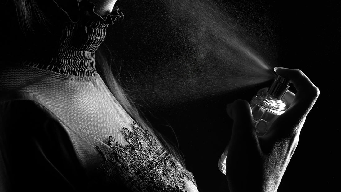 Image depicting proper perfume application technique demonstrated by a woman spraying perfume on her neck, featured in a blog post discussing effective ways to apply perfume on the body for long-lasting fragrance.
